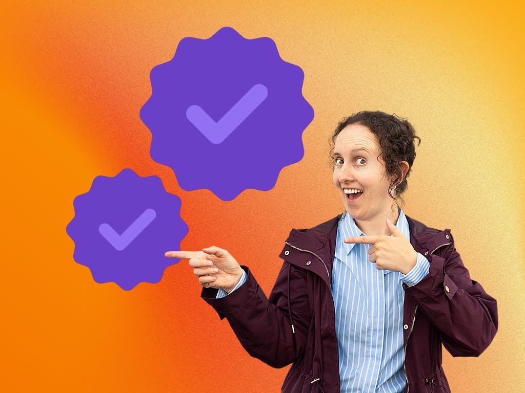 woman pointing with two fingers to two checkmark bubbles